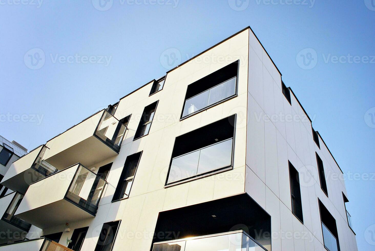 Modern apartment building in sunny day. Exterior, residential house facade. photo