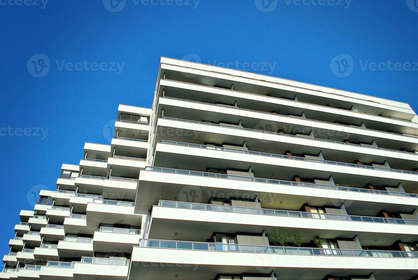 Modern apartment building in sunny day. Exterior, residential house facade. photo