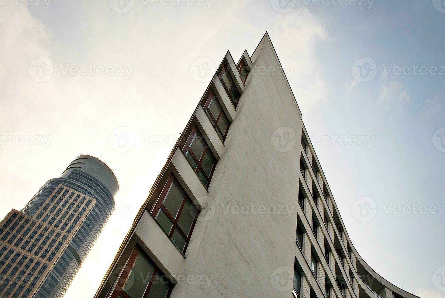 Modern apartment building in sunny day. Exterior, residential house facade. photo