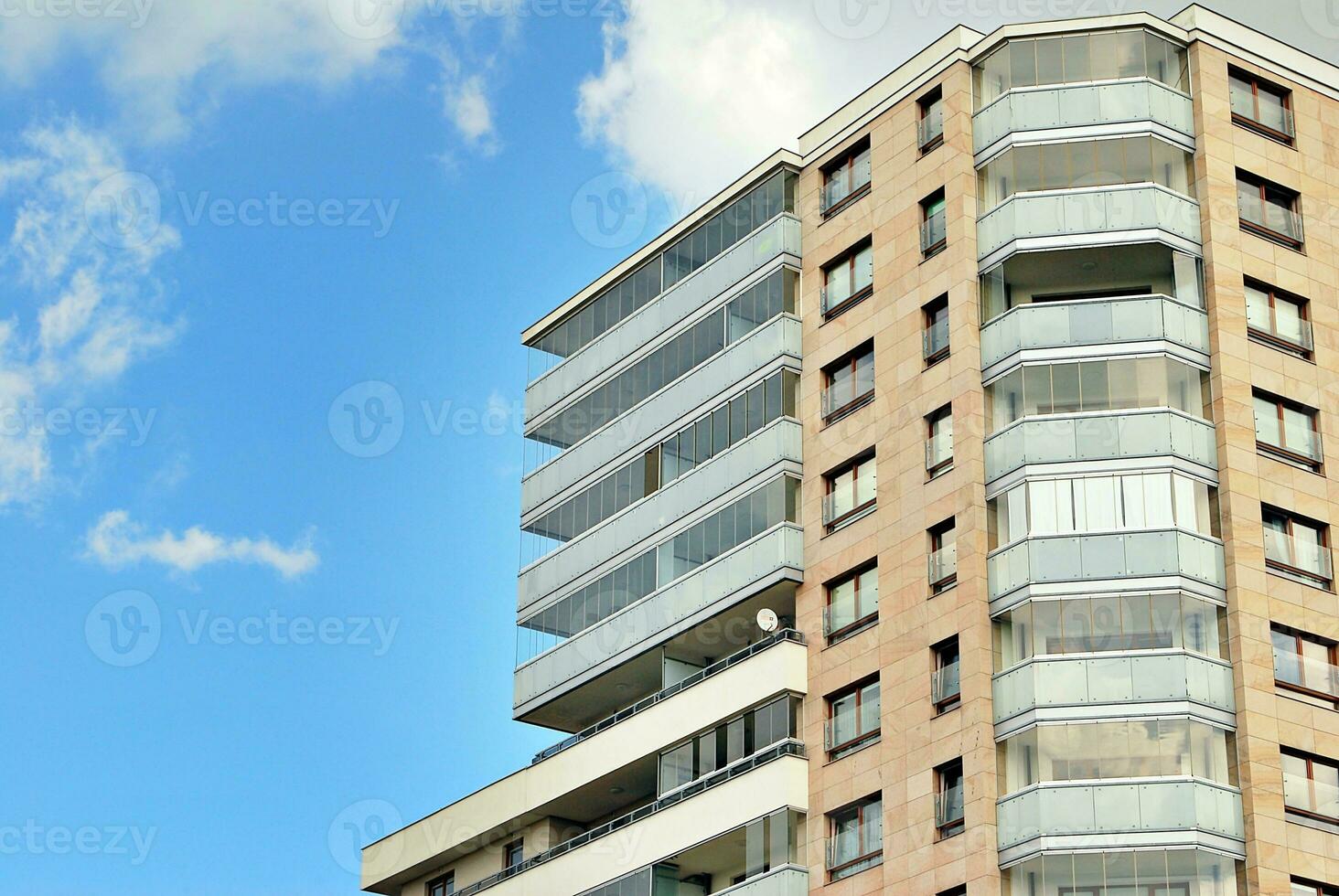 Modern apartment building in sunny day. Exterior, residential house facade. photo