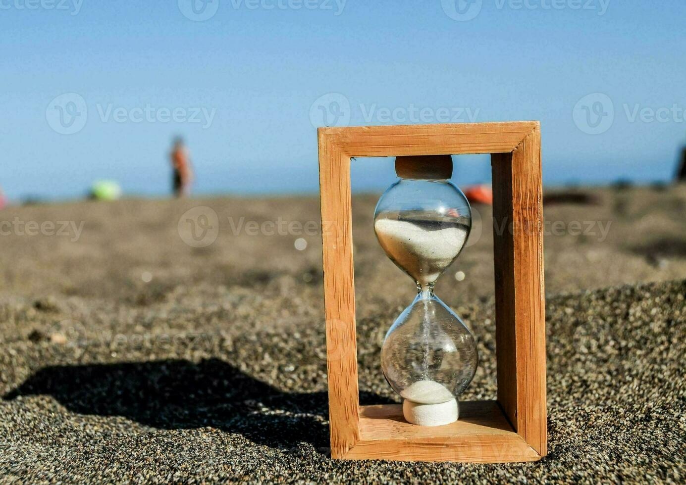 an hourglass on the beach photo