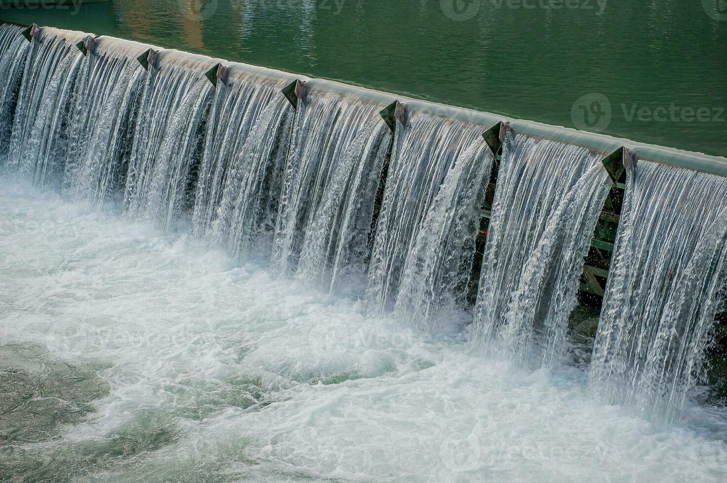 Water overflowing from the dam photo