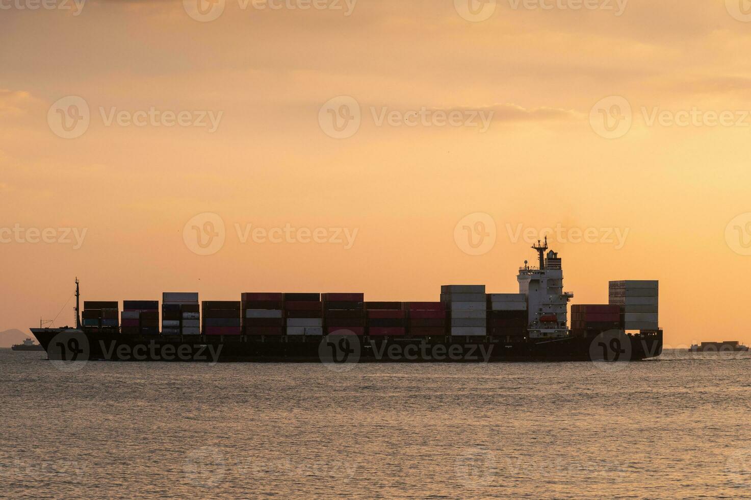 Dynamic cargo ship at sea, the epitome of international trade, Prominent cargo ship sailing across the seas, symbolizing global trade and logistics. photo