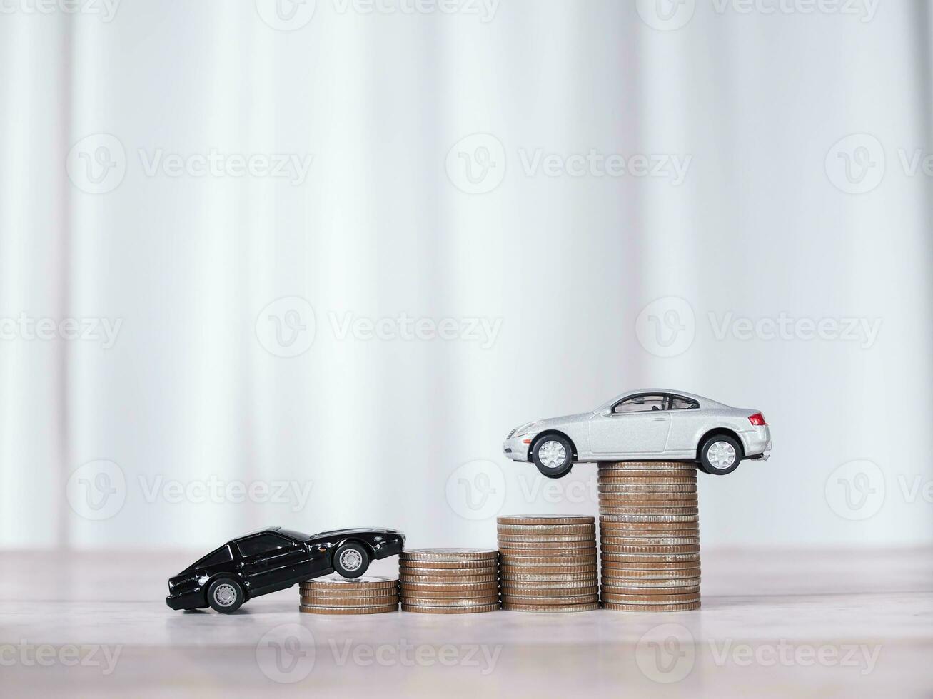 Toy cars with stack of coins. The concept of saving money and manage to success transport business photo