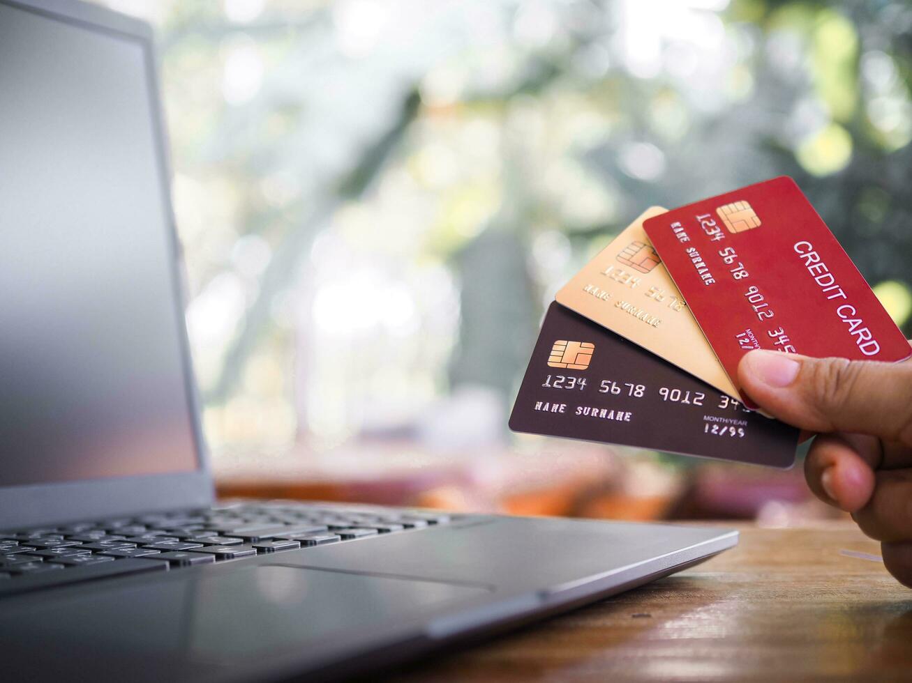 Woman hand holding credit card. The concept of Convenience in the world of technology and the internet, Online shopping, banking transaction, banking online and payment photo