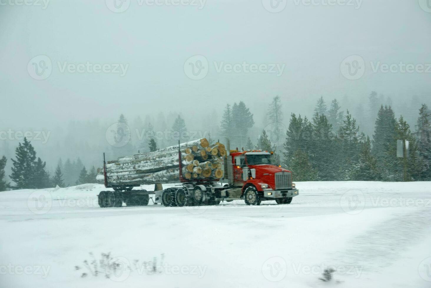 Logging truck on icy road photo