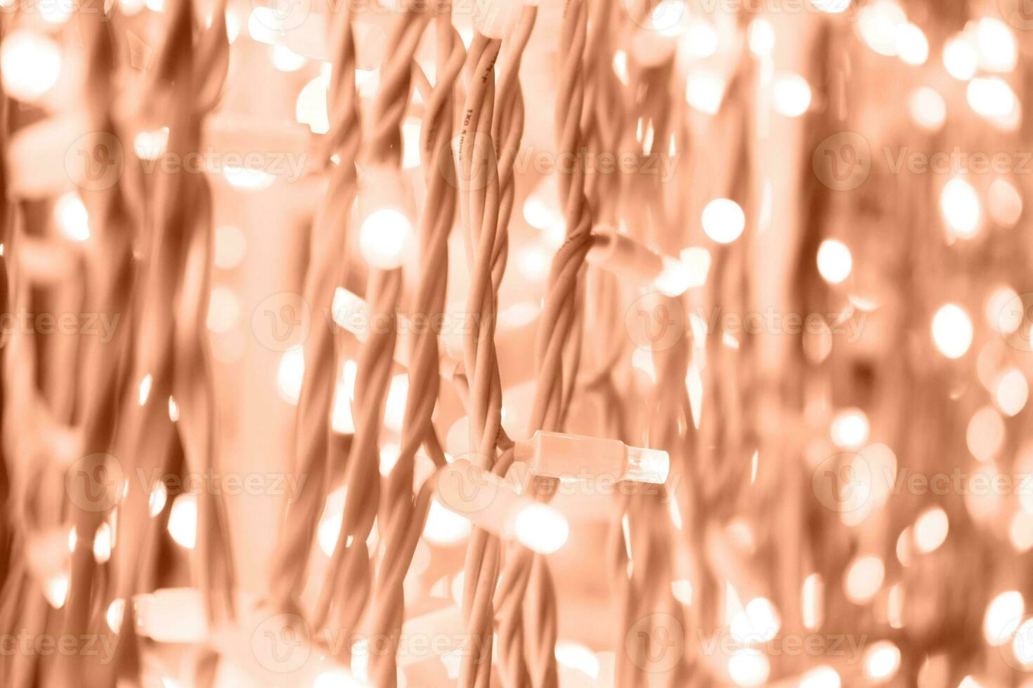 Background of garland lights in a delicate peach color. photo