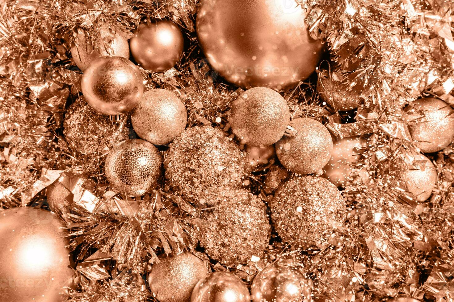 Christmas background of golden color from balls and tinsel photo