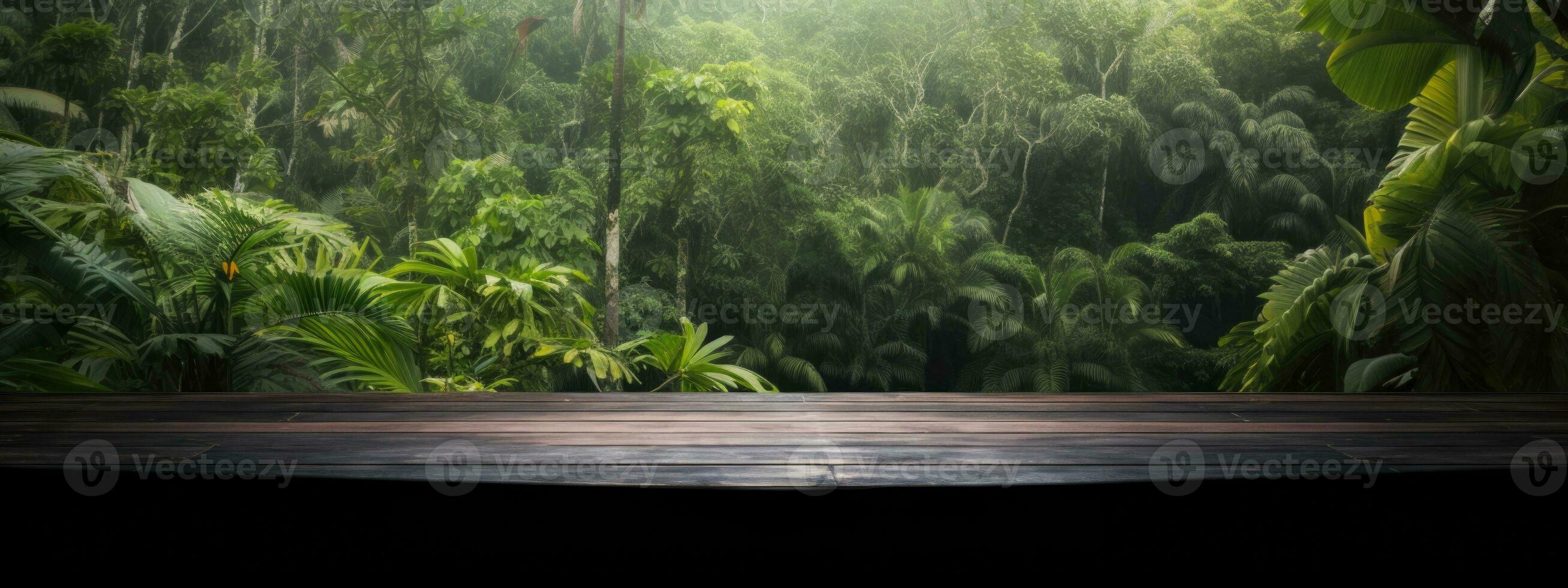 burnt wood table for product presentation. against the background of palm trees and various tropical jungle plants photo