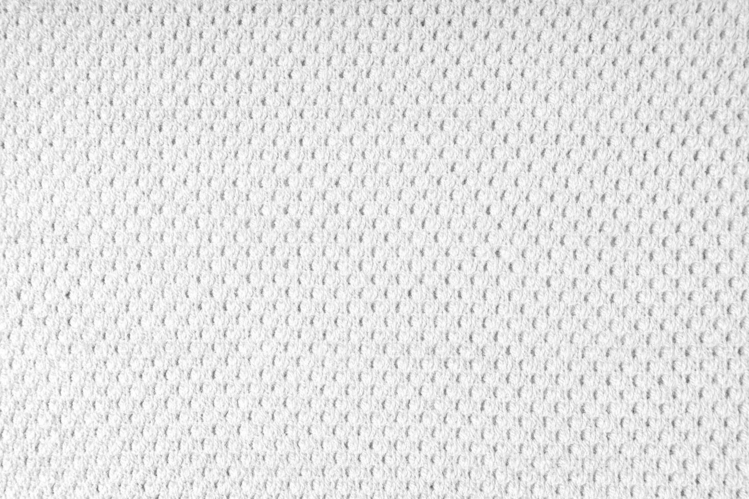 White knitwear wool fabric texture background. Abstract textile backdrop photo