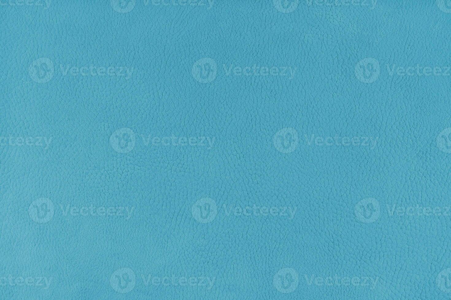 Texture background of cyan velours fabric textured like leather surface photo