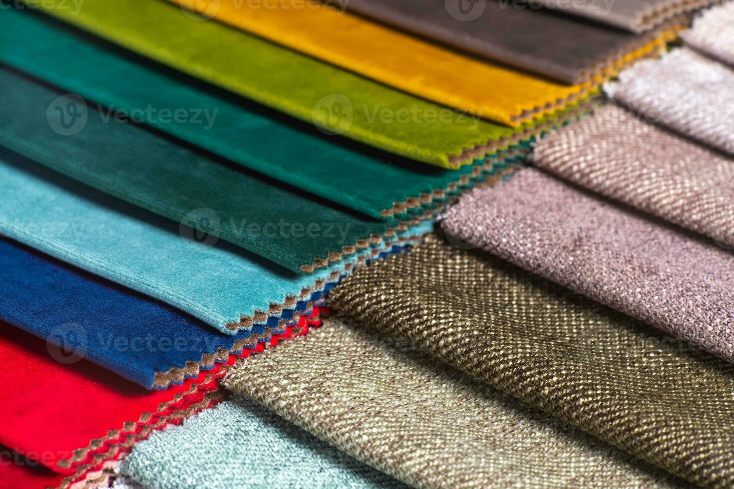 Multi colored set of upholstery fabric samples for selection, collection of textile swatches photo
