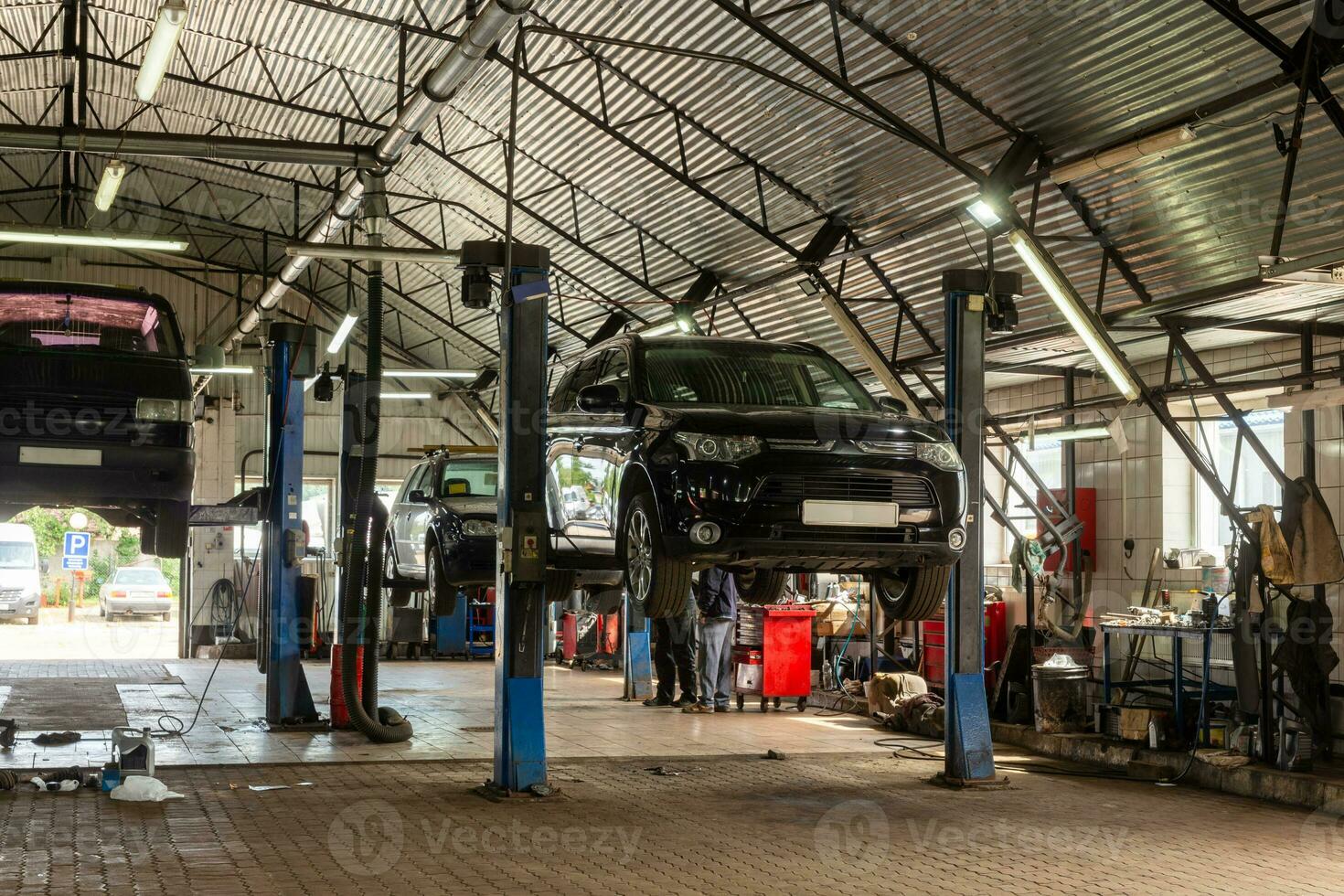 Cars in automobile repair service center. photo