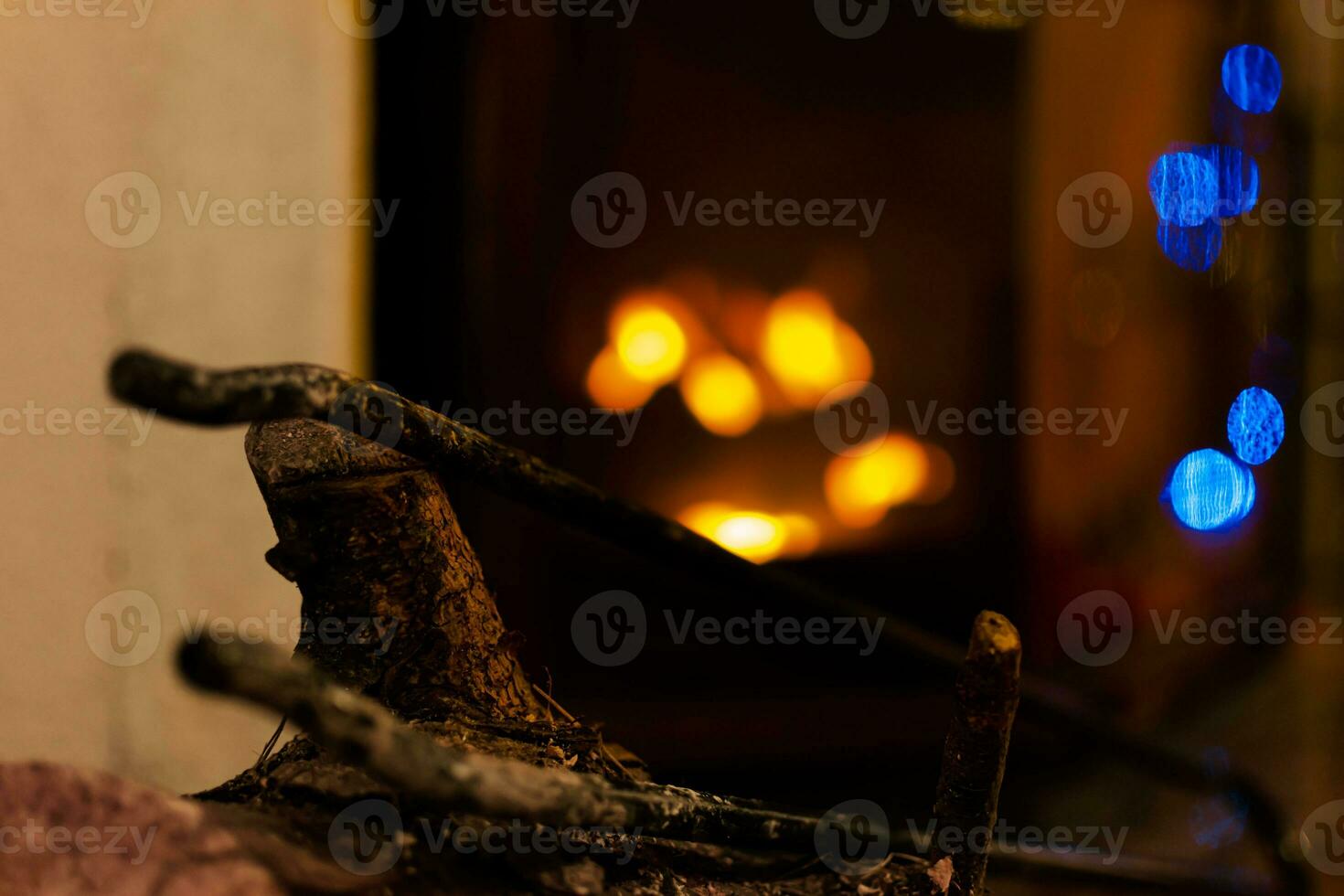 Fire in a fireplace in the living room with accessories photo