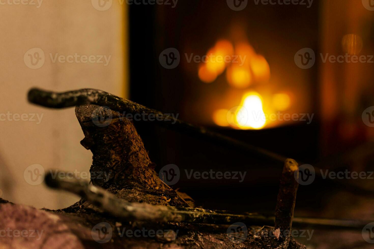 Fire in a fireplace in the living room with accessories photo