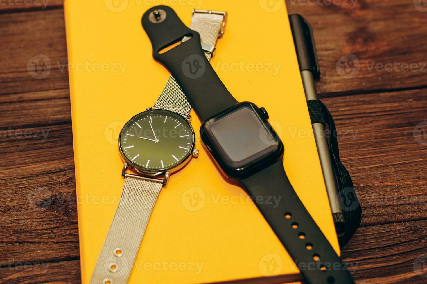 Black technological smart watches and ordinary mechanical watches with a dial. photo