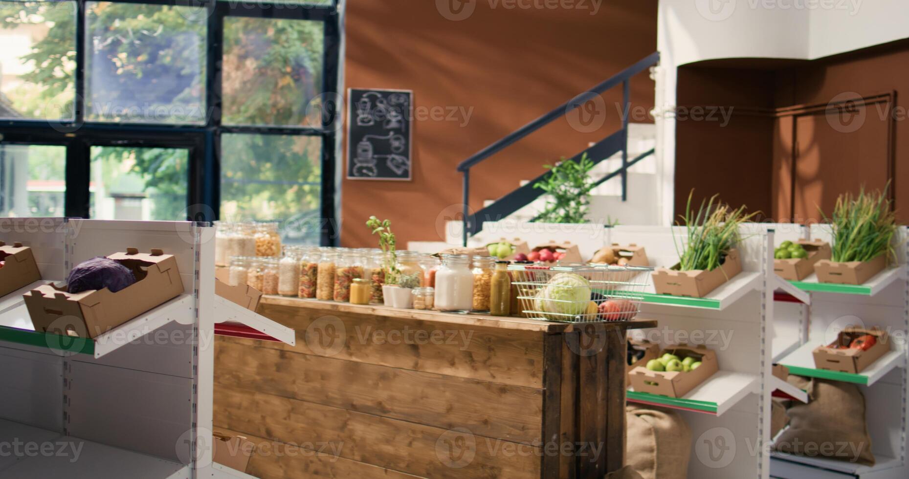 Chemicals free grains and vegetables in eco friendly zero waste supermarket. Organic farming produce and homemade sauces stored in reusable jars, empty store with sustainable lifestyle concept. photo