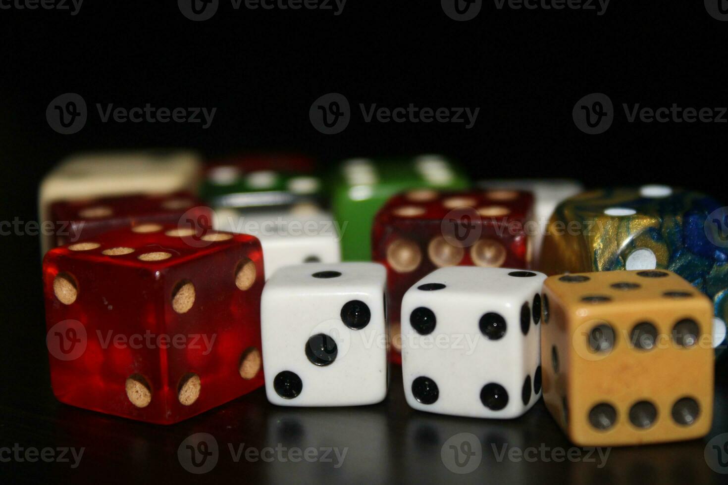 Pile Of Different Colored and Shaped  Dice photo