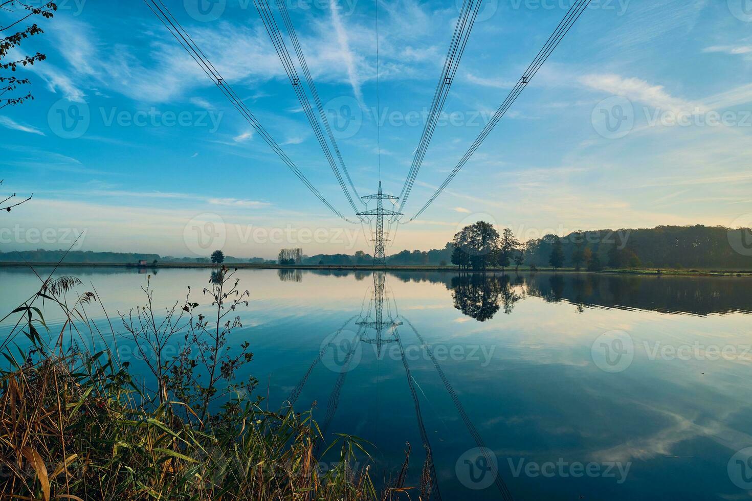Power line over lake in northern Germany photo