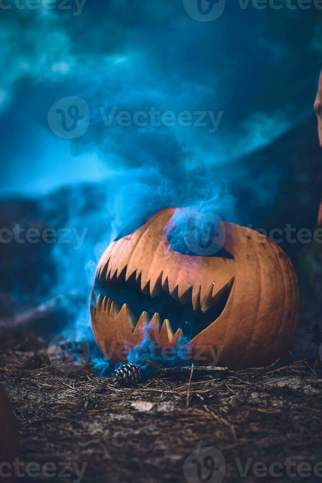 Halloween Pumpkin carved with smoke bomb photo