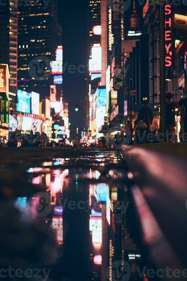 Blurred lights of the TImes Square in New York City at night photo