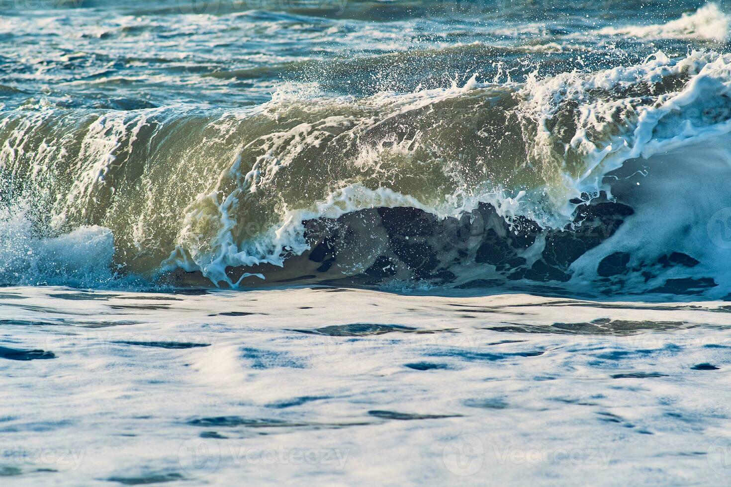 Huge Wave breaking at the north sea coast of Denmark photo