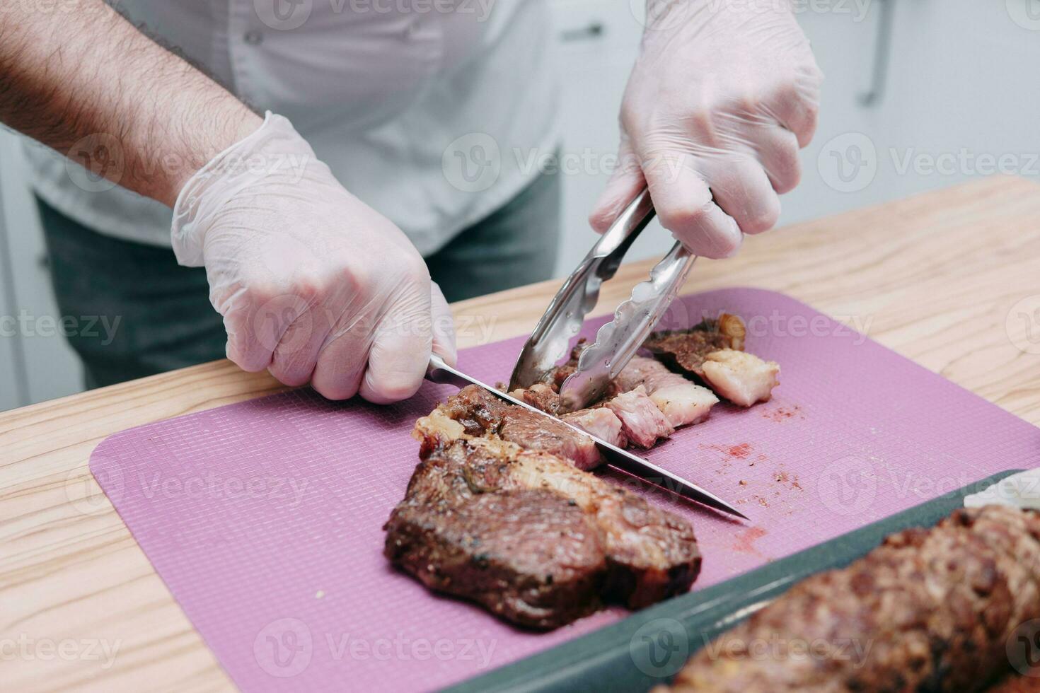 Cooking meat rolls in the cooking class. Beef roll with spices. The process of cutting a roll, close-up. photo
