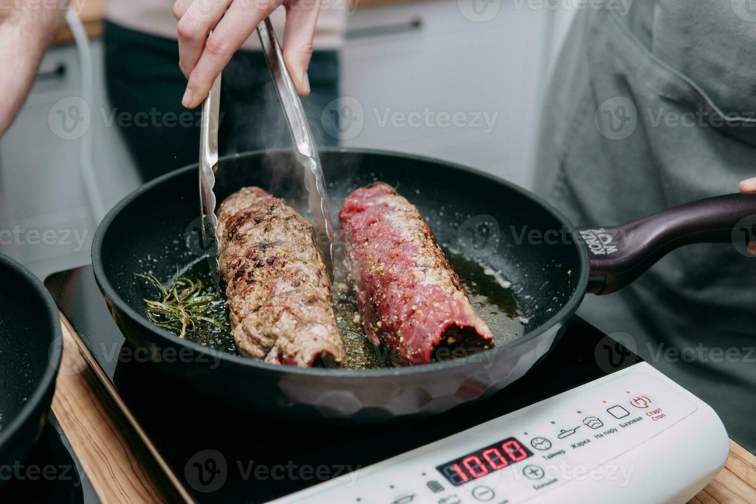 Cooking meat rolls in a frying pan in the cooking class. Beef roll with spices. Cooking process, close-up. photo