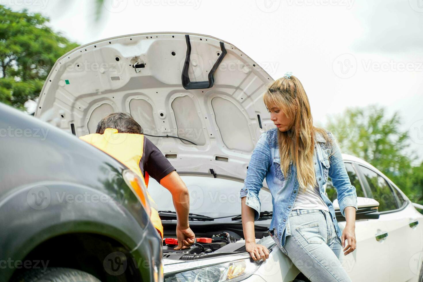 Closeup motor vehicle mechanic checking engine oil to record the repair history photo