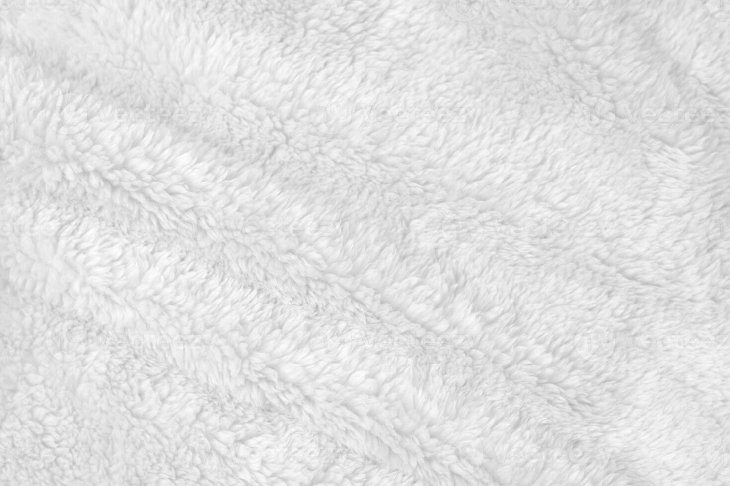 White clean wool texture background. light natural sheep wool. white seamless cotton. texture of fluffy fur for designers. close-up fragment white wool carpet. photo