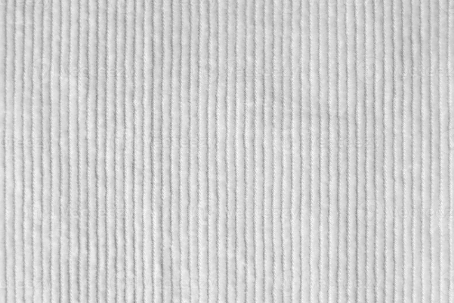 white corduroy fabric texture used as background.  clean fabric background of soft and smooth textile material. cloth, velvet, .luxury white tone for silk. photo