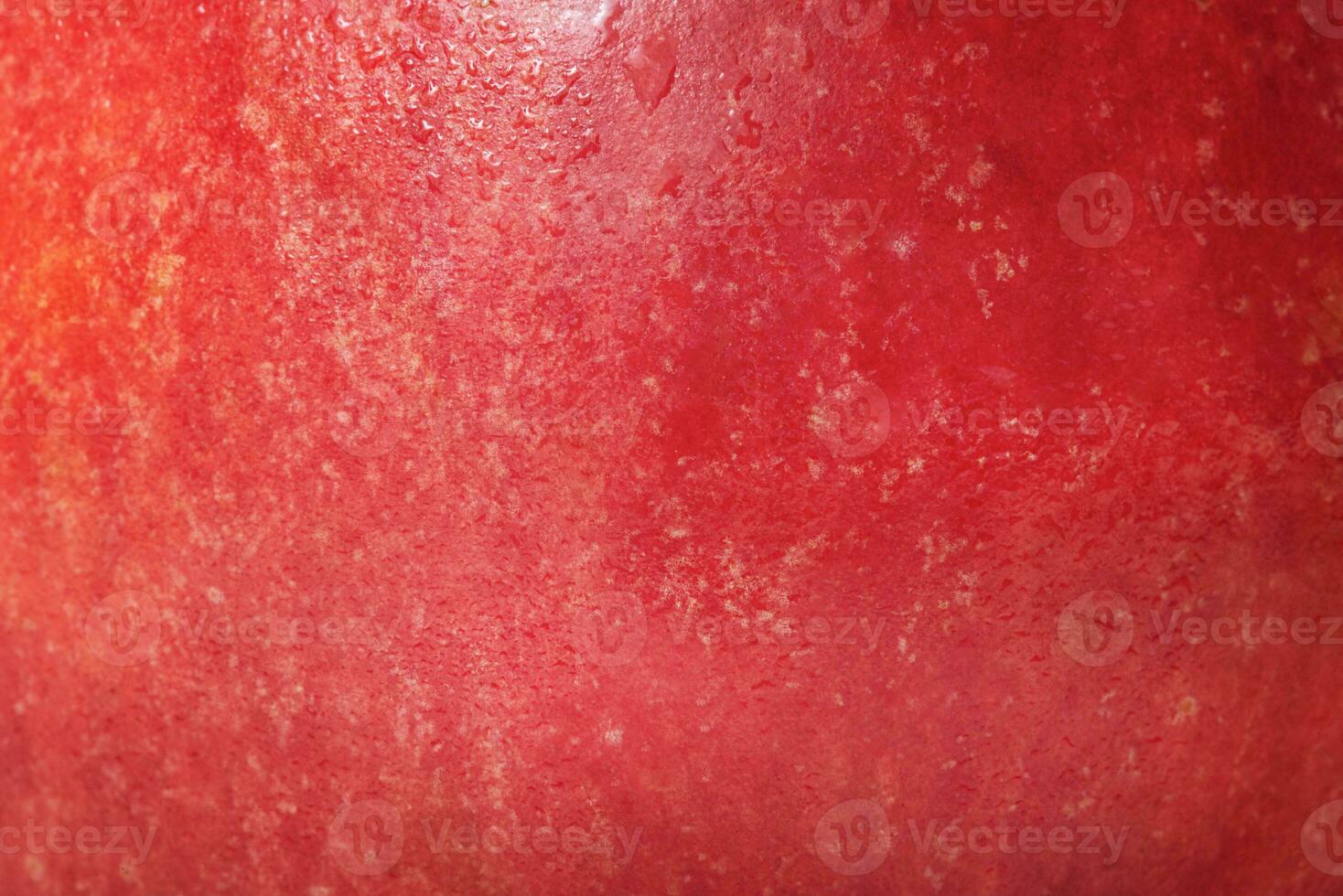 Texture of a red and yellow apple as a background. Macro photo of an apple. Healthy food, fruit.