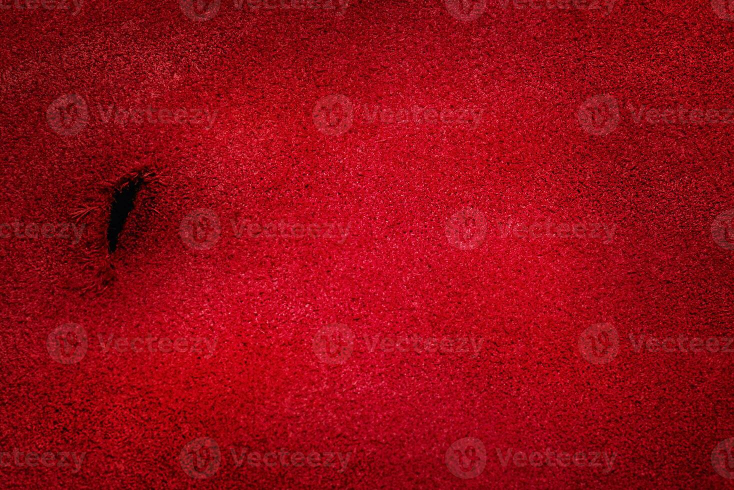 Textured red suede background. Macro photo of suede.