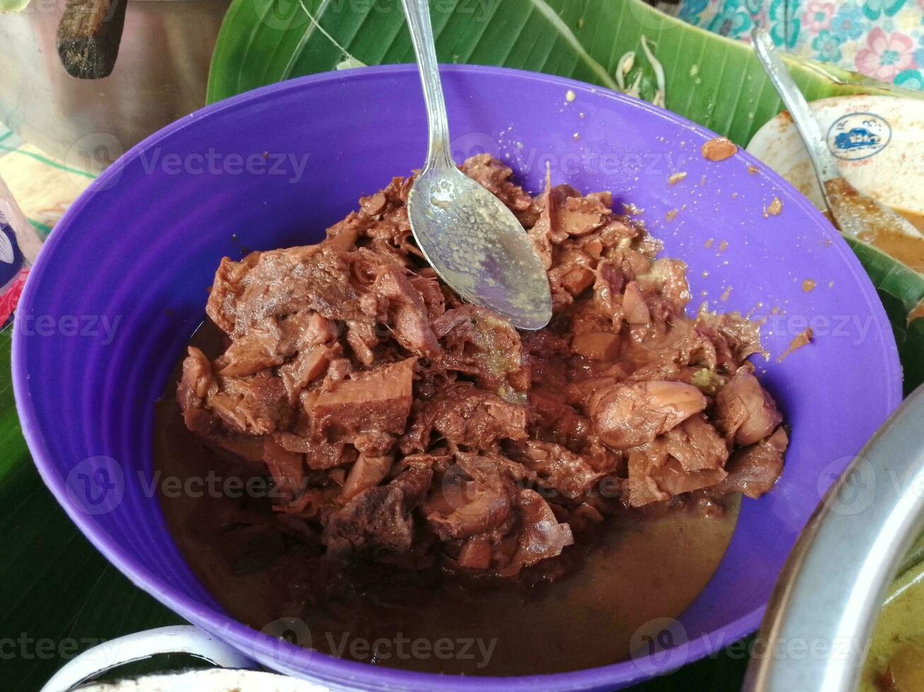 delicious gudeg on purple bowl. gudeg is traditional indonesian food photo