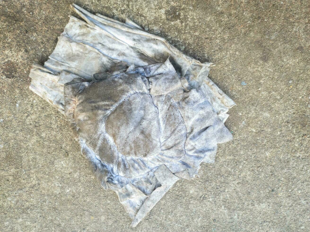 dirty rag that has been used to clean grease and oil residue. concept photo of an example of B3 toxic waste