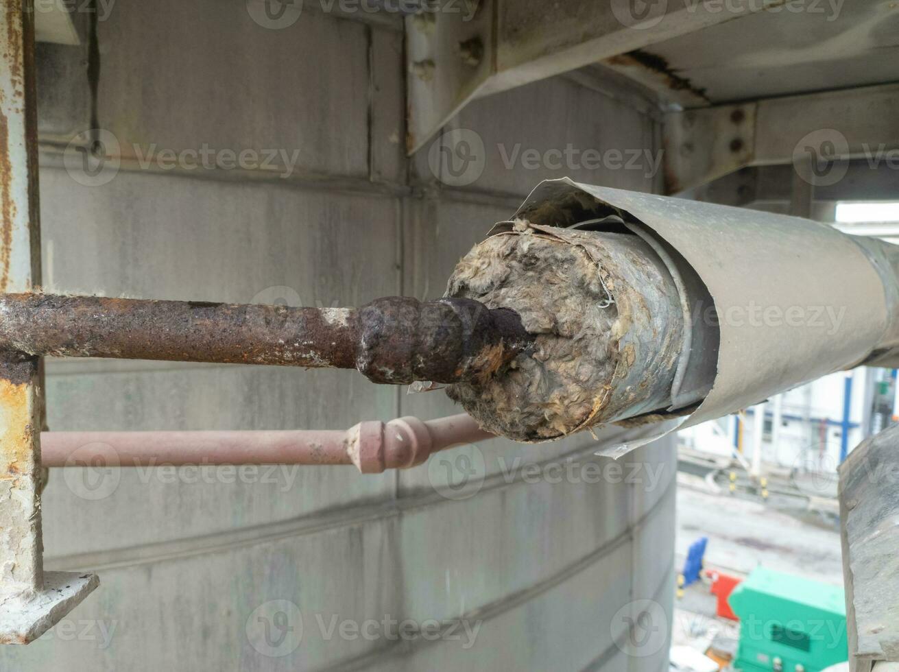 Steam pipe lines wrapped in glass wool function to maintain hot or cold temperatures photo