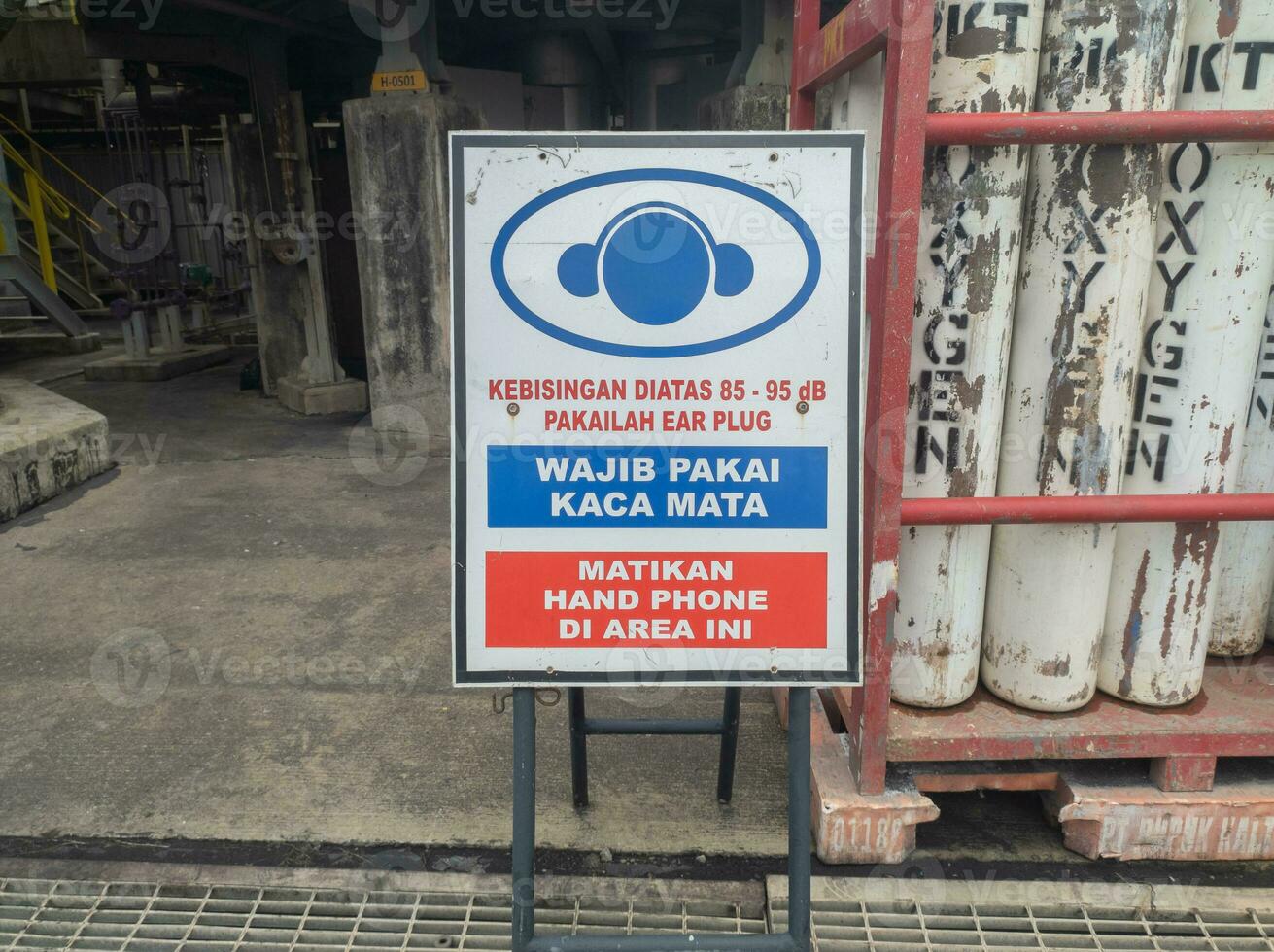 warning boards stating noise levels, mandatory use of glasses and prohibition of using cell phones photo