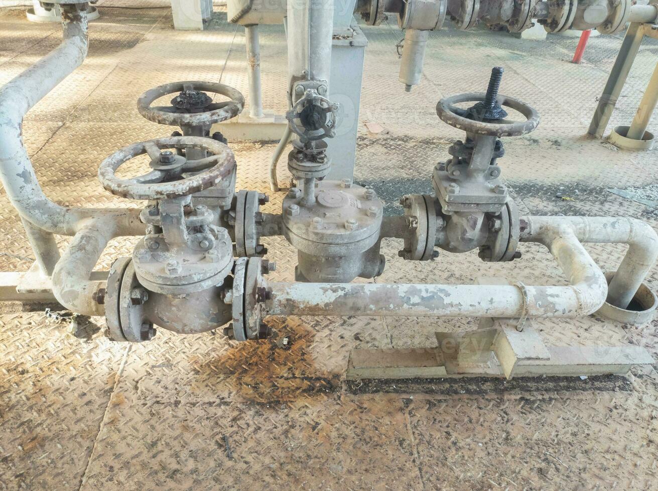 factory pipe lines with several series of valves photo