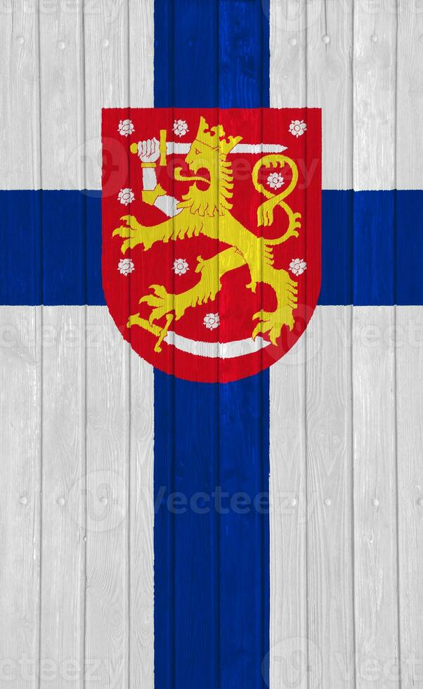 Flag and coat of arms of Republic of Finland on a textured background. Concept collage. photo