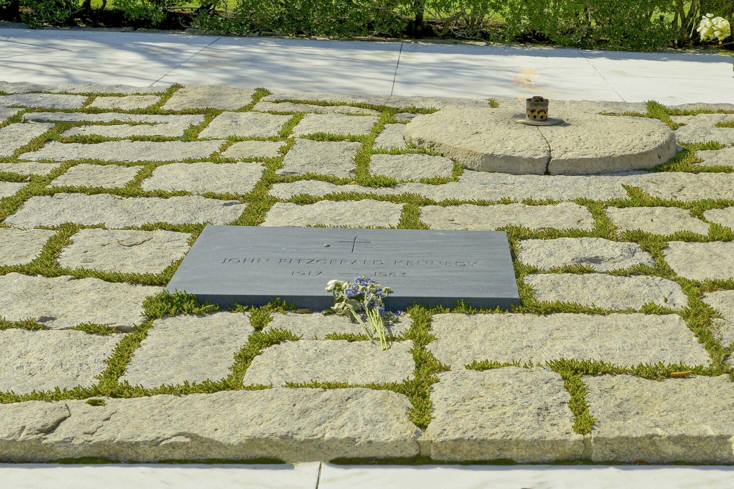 Arlington Cemetery, VA, USA 2023. The eternal flame and headstone of President John F Kennedy at Arlington National Cemetery in Virginia photo
