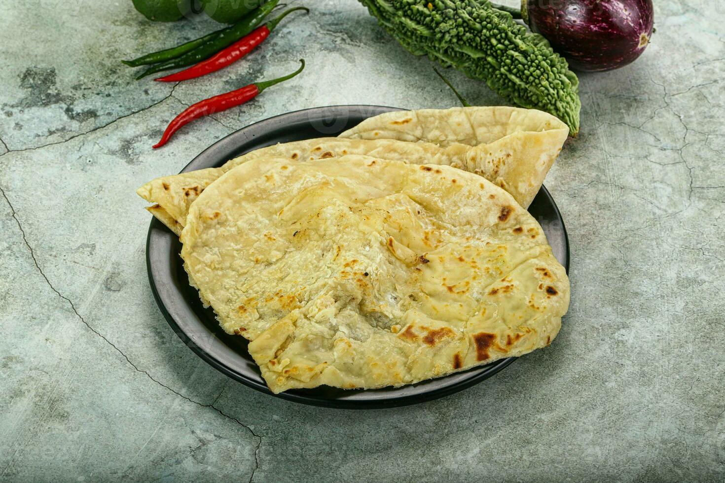 indio tandori un pan - naan con queso foto