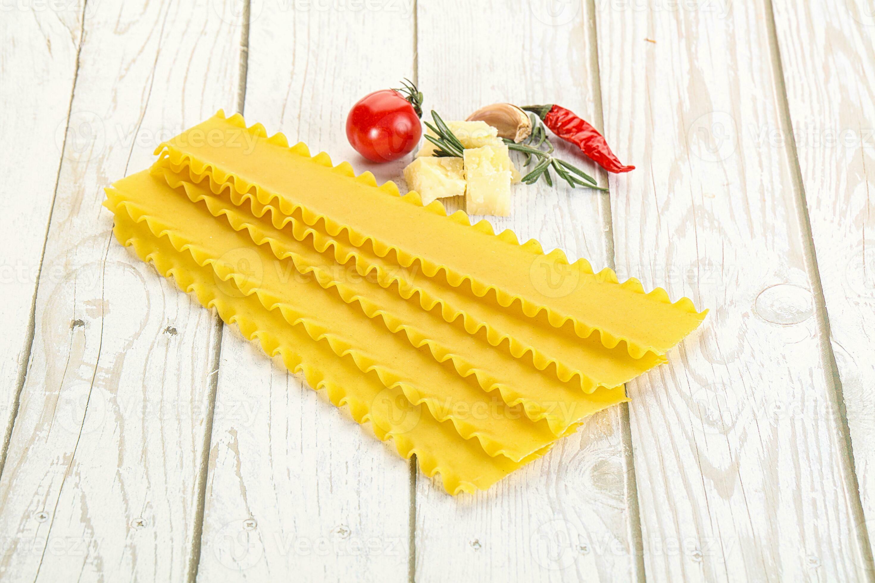 Uncooked raw Lasagna dry sheets 35332004 Stock Photo at Vecteezy