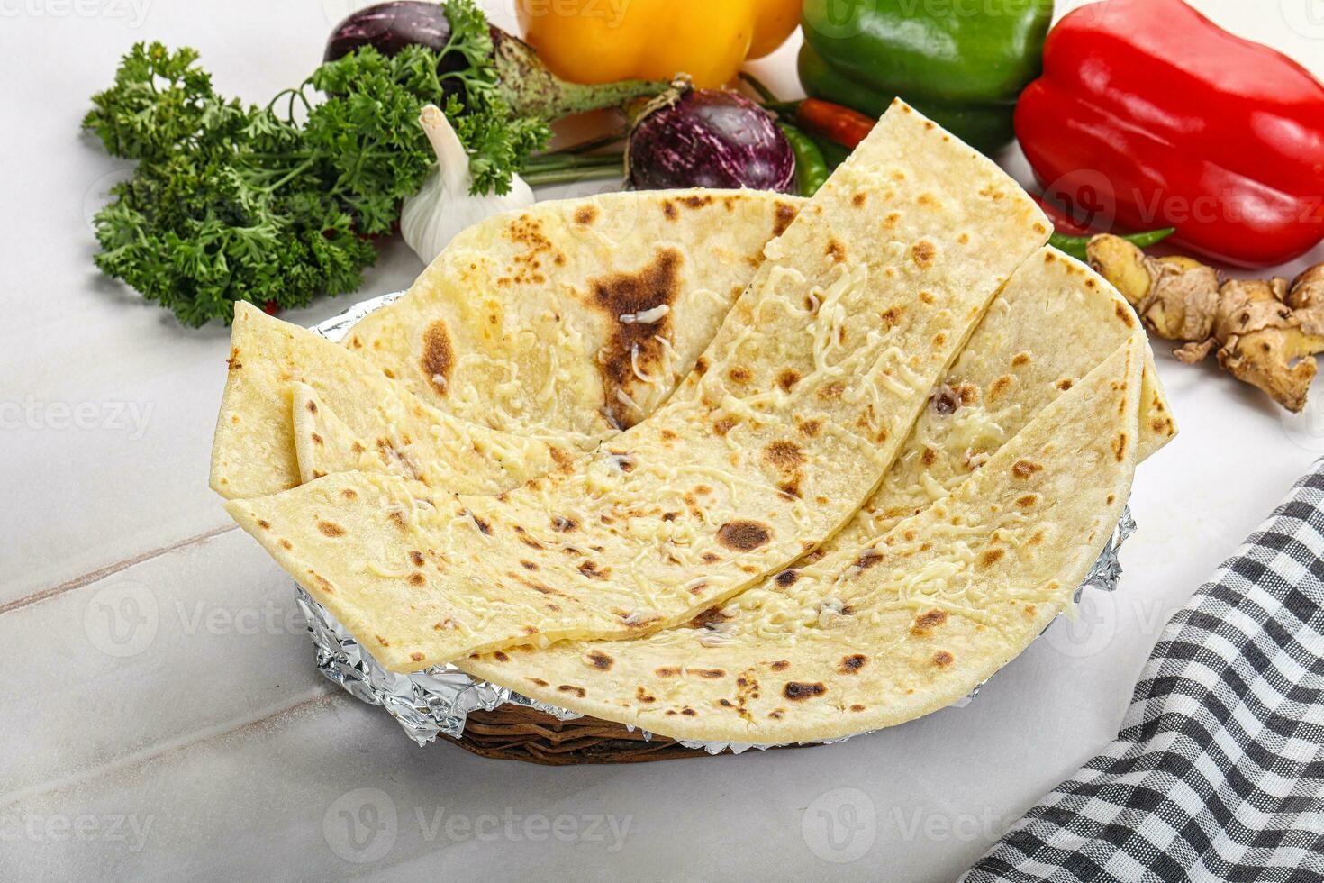 Indian bread cheese garlic naan photo