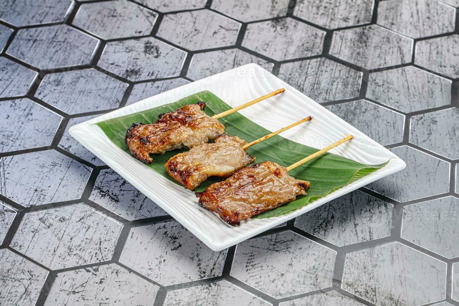 Thai cuisine - grilled pork skewer photo