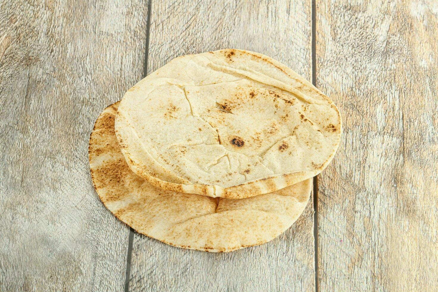 Traditional eastern round pita bread photo