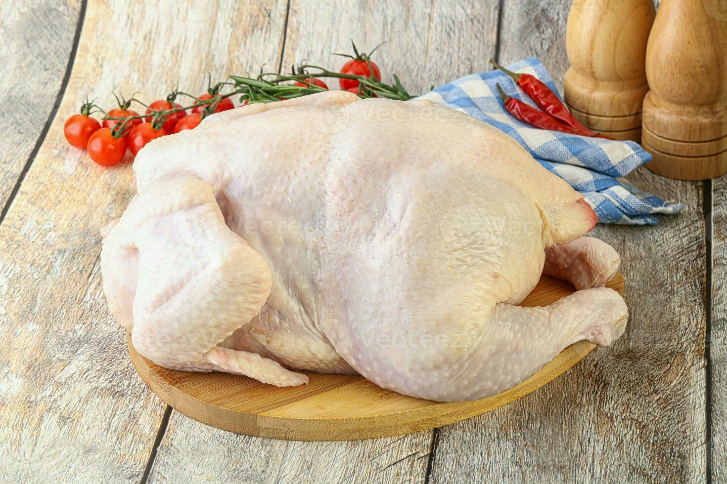 Whole raw chicken for cooking photo