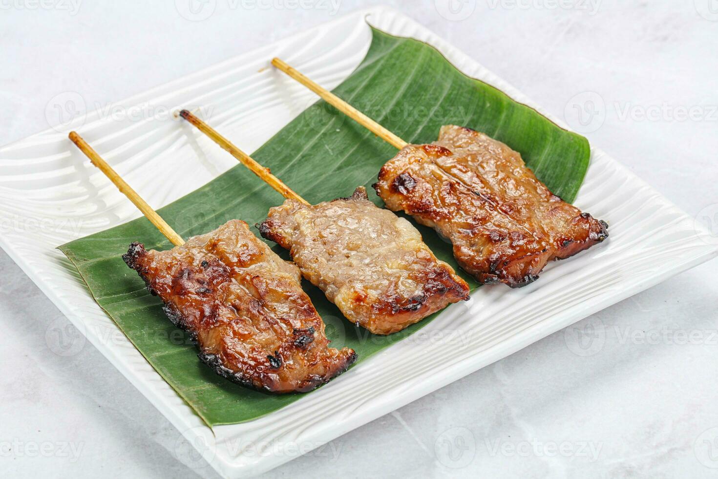 Thai cuisine - grilled pork skewer photo