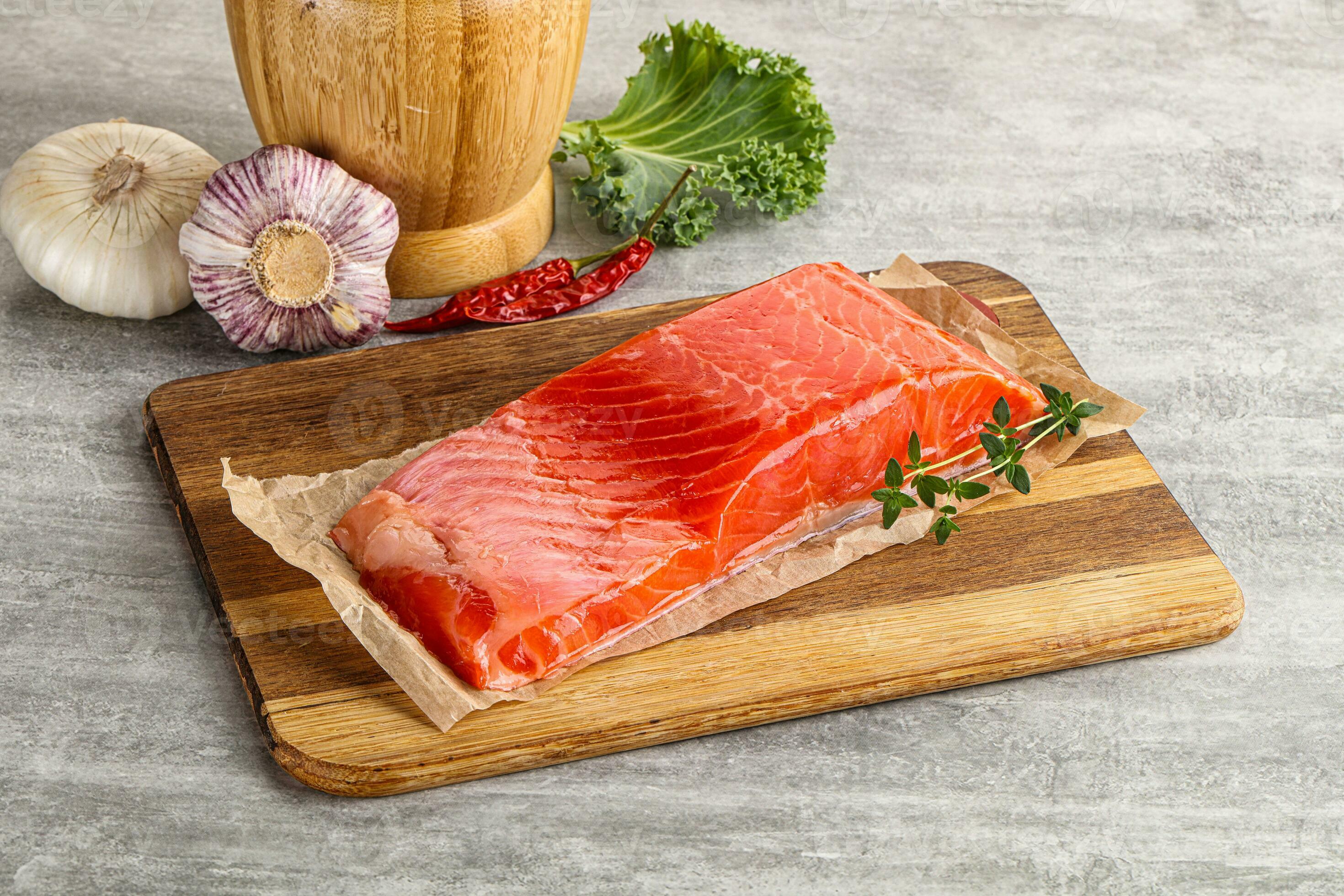 Raw salmon fillet over board 35332724 Stock Photo at Vecteezy