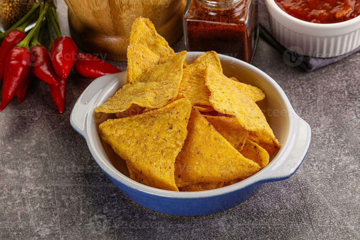 Mexican corn nachos chips with salsa photo