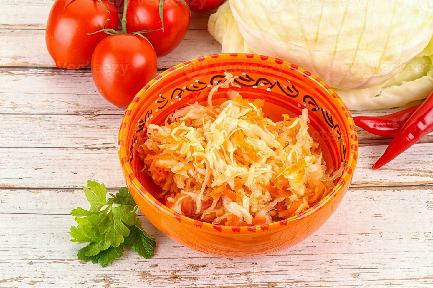 Fermented cabbage sauerkraut in the bowl photo